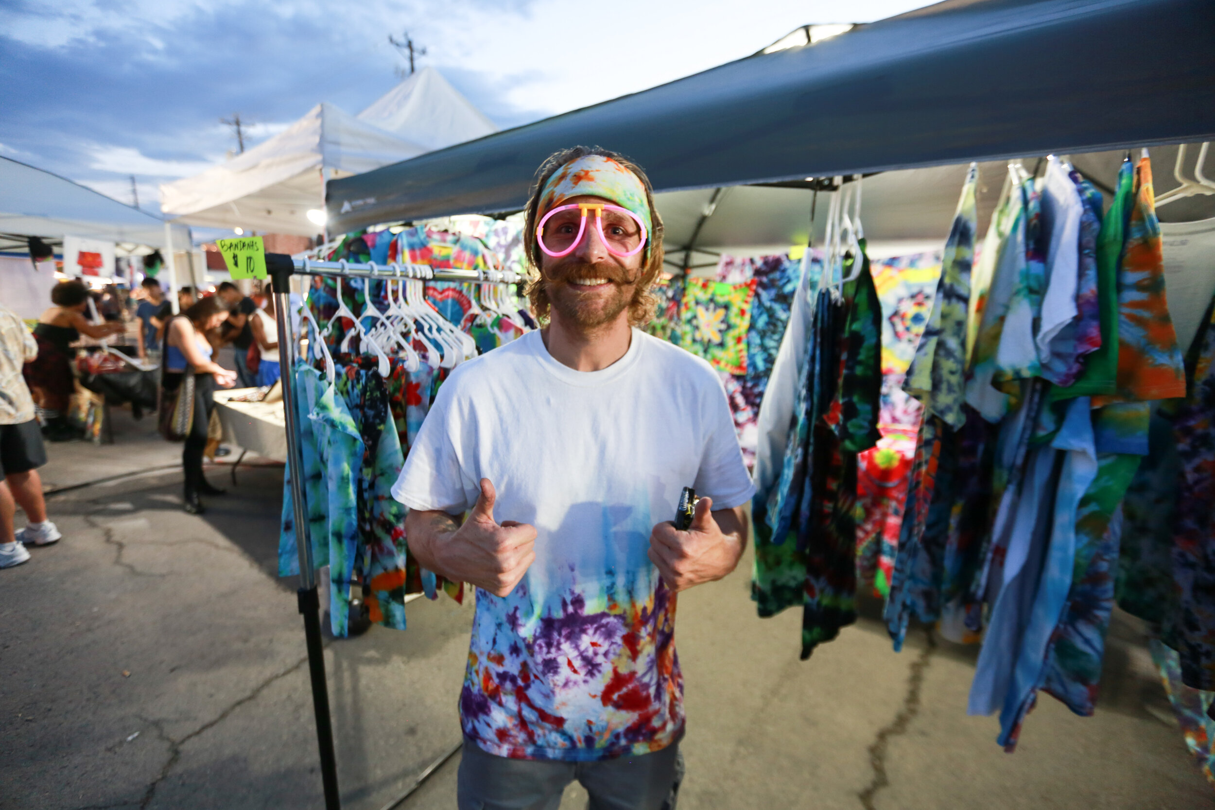 Attendees browsing art displays at First Friday Las Vegas